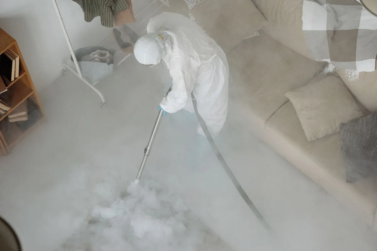Biohazard cleanup technician in protective equipment, Bridgeport, CT